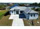 Single-story house with driveway and landscaped lawn at 10404 Monticello Dr, Port Charlotte, FL 33981