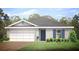 Single-story home with gray siding, gray roof, and landscaping at 12442 Evelyn Ave, Port Charlotte, FL 33981