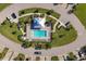 Community pool with surrounding landscaping, and parking at 14025 Black Beauty Dr # 412, Punta Gorda, FL 33955