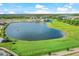 Community overview featuring a lake and golf course at 14025 Black Beauty Dr # 412, Punta Gorda, FL 33955
