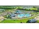 Resort-style pool and clubhouse with tennis courts nearby at 14025 Black Beauty Dr # 412, Punta Gorda, FL 33955
