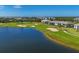 Community overview showcasing lake, golf course, and homes at 14025 Black Beauty Dr # 412, Punta Gorda, FL 33955