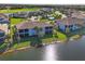 Luxury community aerial view, featuring lake and homes at 14025 Black Beauty Dr # 412, Punta Gorda, FL 33955