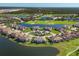 Expansive aerial view of community with golf course and lake at 14025 Black Beauty Dr # 412, Punta Gorda, FL 33955