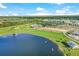 Community overview with lake and golf course at 14025 Black Beauty Dr # 412, Punta Gorda, FL 33955