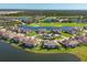 Expansive aerial view of community with golf course and lake at 14025 Black Beauty Dr # 412, Punta Gorda, FL 33955