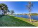Landscaped backyard with lake view and lush greenery at 14025 Black Beauty Dr # 412, Punta Gorda, FL 33955