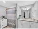 Guest bathroom with shower/tub combo and granite vanity at 14025 Black Beauty Dr # 412, Punta Gorda, FL 33955