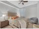 Cozy bedroom with queen-size bed and a comfortable armchair at 14025 Black Beauty Dr # 412, Punta Gorda, FL 33955