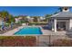 Community pool with lounge chairs, gazebo, and surrounding landscaping at 14025 Black Beauty Dr # 412, Punta Gorda, FL 33955