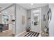 Inviting entryway with bench, storage, and view into kitchen at 14025 Black Beauty Dr # 412, Punta Gorda, FL 33955