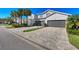 Three-unit building with attached garages and landscaping at 14025 Black Beauty Dr # 412, Punta Gorda, FL 33955