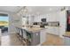Gorgeous kitchen with island seating, stainless steel appliances, and white cabinets at 14025 Black Beauty Dr # 412, Punta Gorda, FL 33955