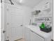 Convenient laundry room with washer, dryer, and storage shelves at 14025 Black Beauty Dr # 412, Punta Gorda, FL 33955