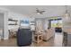 Spacious living room with comfy seating, large TV, and access to patio at 14025 Black Beauty Dr # 412, Punta Gorda, FL 33955