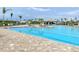 Resort-style pool with lounge chairs at 14025 Black Beauty Dr # 412, Punta Gorda, FL 33955
