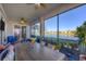 Spacious screened lanai with lake views and a large dining table at 14025 Black Beauty Dr # 412, Punta Gorda, FL 33955