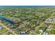 Aerial view of a neighborhood with waterfront properties and canals at 18511 Lake Worth Blvd, Port Charlotte, FL 33948