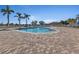 Community pool with plenty of lounge chairs at 2001 Bal Harbor Blvd # 2312, Punta Gorda, FL 33950