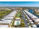 Aerial view of community with pool, tennis court, and canal access at 2002 Bal Harbor Boulevard # 811, Punta Gorda, FL 33950