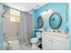 Clean bathroom with a tub shower combo, and updated vanity at 2002 Bal Harbor Boulevard # 811, Punta Gorda, FL 33950