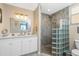 Elegant bathroom with double vanity, large walk-in shower, and glass block feature at 2002 Bal Harbor Boulevard # 811, Punta Gorda, FL 33950
