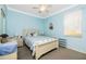 Charming bedroom with a full-size bed and light blue walls at 2002 Bal Harbor Boulevard # 811, Punta Gorda, FL 33950