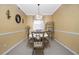 Dining room features a table, four chairs, and a decorative wine rack at 2002 Bal Harbor Boulevard # 811, Punta Gorda, FL 33950