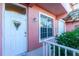 Front door with a charming flower basket and a welcome mat at 2002 Bal Harbor Boulevard # 811, Punta Gorda, FL 33950