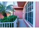 Ground level entrance with white railings and lush tropical plants at 2002 Bal Harbor Boulevard # 811, Punta Gorda, FL 33950