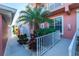 Side entrance with stairs, landscaping, and a white railing at 2002 Bal Harbor Boulevard # 811, Punta Gorda, FL 33950