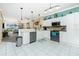 Spacious kitchen with white cabinets, stainless steel appliances, and a breakfast bar at 2002 Bal Harbor Boulevard # 811, Punta Gorda, FL 33950
