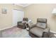 Home office featuring two leather recliners, a small table and neutral decor at 2002 Bal Harbor Boulevard # 811, Punta Gorda, FL 33950