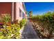 Sidewalk with landscaping alongside the building at 2002 Bal Harbor Boulevard # 811, Punta Gorda, FL 33950