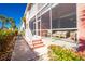 Sidewalk view of screened porch and building exterior at 2002 Bal Harbor Boulevard # 811, Punta Gorda, FL 33950