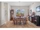 Bright dining room with wood floor and large window at 2090 Aqui Esta Dr, Punta Gorda, FL 33950