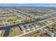 Aerial view of houses situated on a canal, surrounded by other homes and natural landscape at 222 Boundary Blvd # 222P, Rotonda West, FL 33947