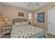 Bedroom with coastal decor, a queen-size bed, and light brown walls at 222 Boundary Blvd # 222P, Rotonda West, FL 33947