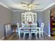 Charming dining room with a white table and chairs, and a beautiful hutch at 23260 Mcnamee Ave, Port Charlotte, FL 33980