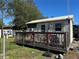 Small guest house with a deck and surrounding yard at 23260 Mcnamee Ave, Port Charlotte, FL 33980