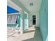 Bright entryway with modern console table and large mirror at 2436 Rosa Ln, Punta Gorda, FL 33950