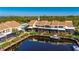 Aerial view of condo building with private boat dock and water access at 25188 Marion Ave # 1006, Punta Gorda, FL 33950