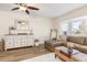 Spacious living room featuring a bay window and stylish furniture at 25475 Terrain Ln, Punta Gorda, FL 33983