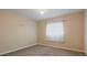 Simple bedroom with carpeted floor and window at 268 Maraca St, Punta Gorda, FL 33983