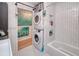 Clean bathroom with stackable washer and dryer at 28427 Sabal Palm Dr, Punta Gorda, FL 33982