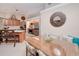 Kitchen and dining area with breakfast bar and view into the living room at 28427 Sabal Palm Dr, Punta Gorda, FL 33982