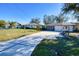 Home exterior with driveway and garage at 28427 Sabal Palm Dr, Punta Gorda, FL 33982