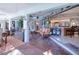 Inviting sunroom with brick floors and access to the kitchen offers relaxation and entertainment space at 28427 Sabal Palm Dr, Punta Gorda, FL 33982