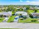 Aerial view of single-Gathering home with landscaped yard and driveway at 3014 Guadalupe Dr, Punta Gorda, FL 33950