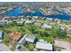 Aerial view of the property and surrounding neighborhood, highlighting waterfront access at 3014 Guadalupe Dr, Punta Gorda, FL 33950